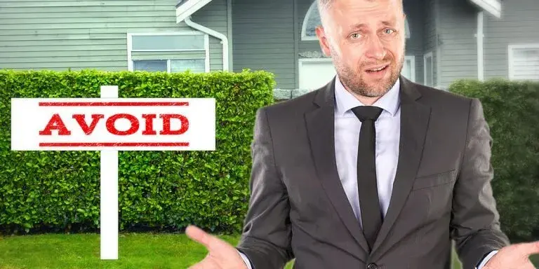 Avoid-Mistakes-Home-Selling-Best-Texas-House-Buyers-Dallas Confused man standing in front of a house with an “Avoid” sign, symbolizing the pitfalls homeowners can bypass by selling directly to Best Texas House Buyers in Dallas